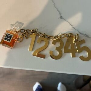 Chanel vintage Fake Gold Number Charm Bracelet with Orange Perfume